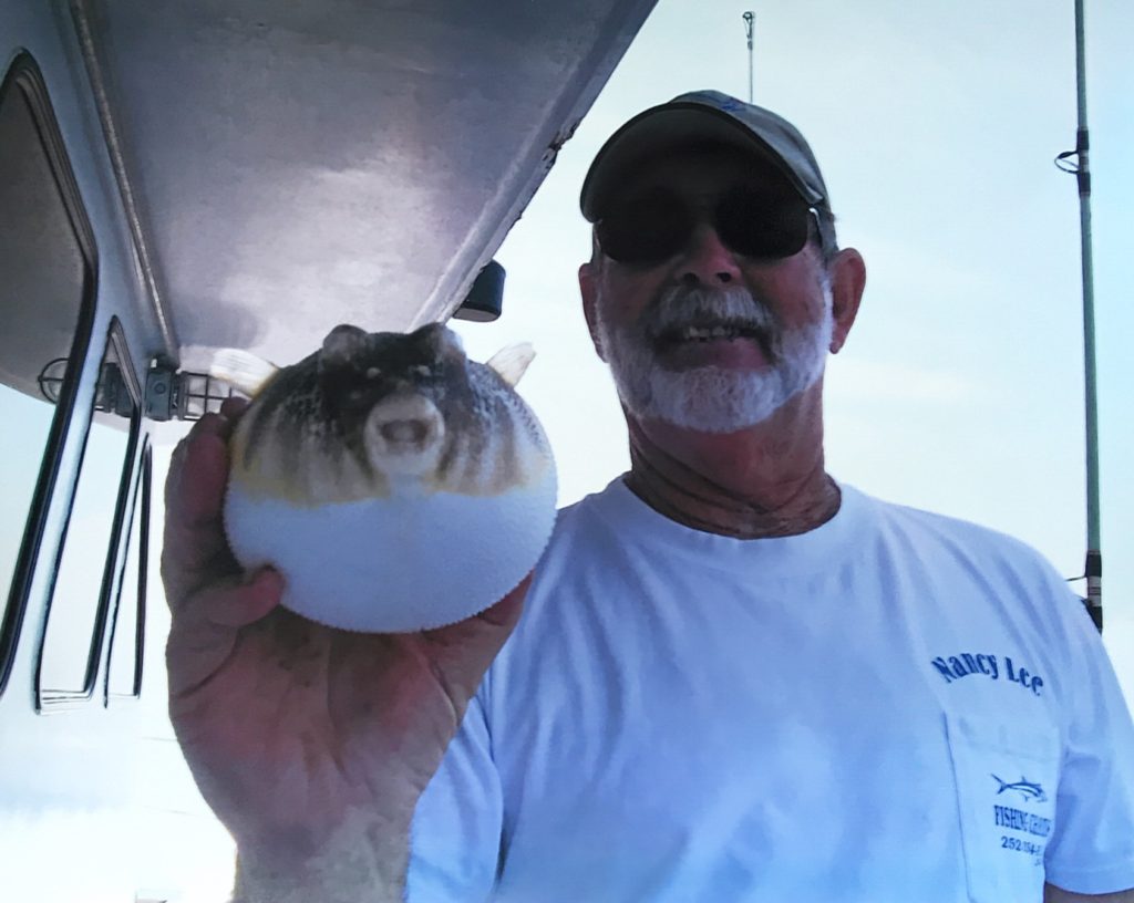 Captain Lee holding a puffer fish